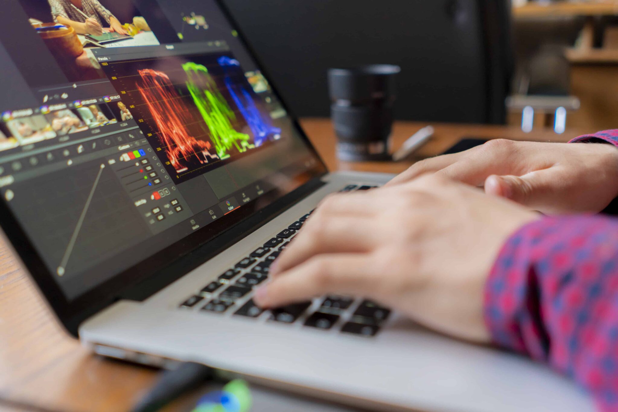 male producer edit video his laptop studio